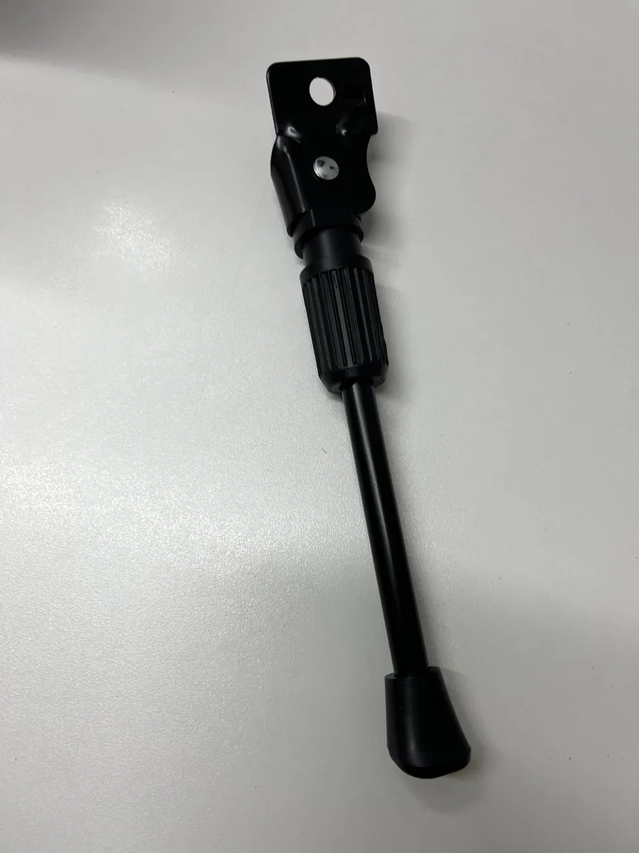 The Kickaroo kickstand laid on a white surface, mounting plate, adjustment collar and rubber foot in full view, photographed by a verified buyer